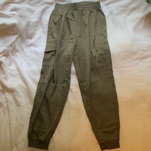 Olive green cargo pants. Fits XS-S for baggier look. Brand new with tags.